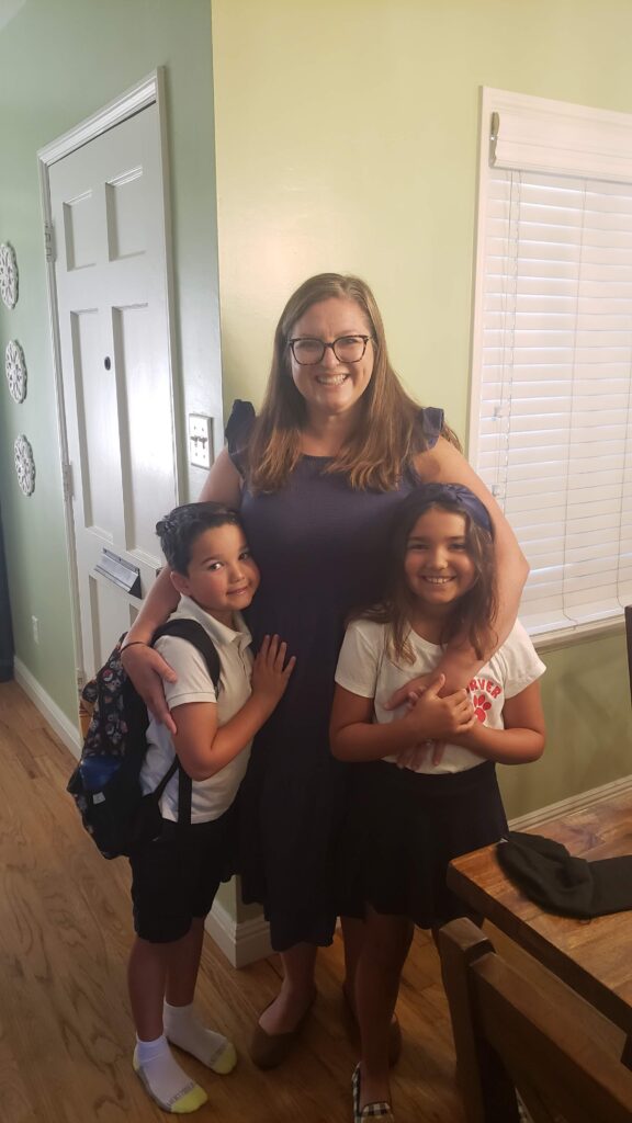 mom and kids going to school