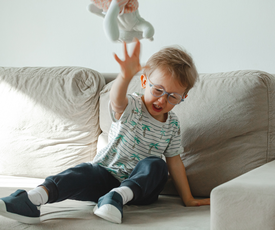 boy throwing toy